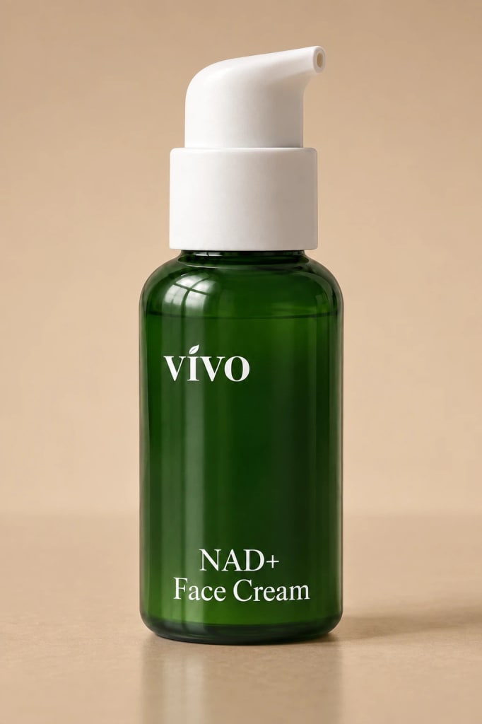 Vivo NAD+ Face Cream in a forest green pump bottle with white lettering, photographed on a warm tan backdrop