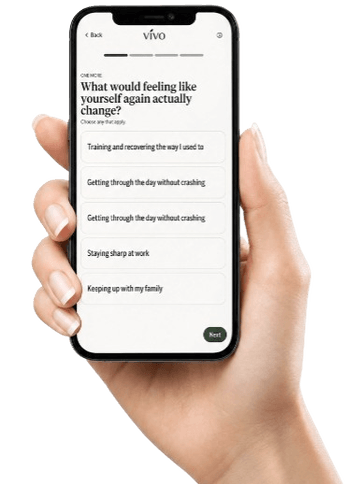 A hand holding a phone showing the Vivo intake questionnaire